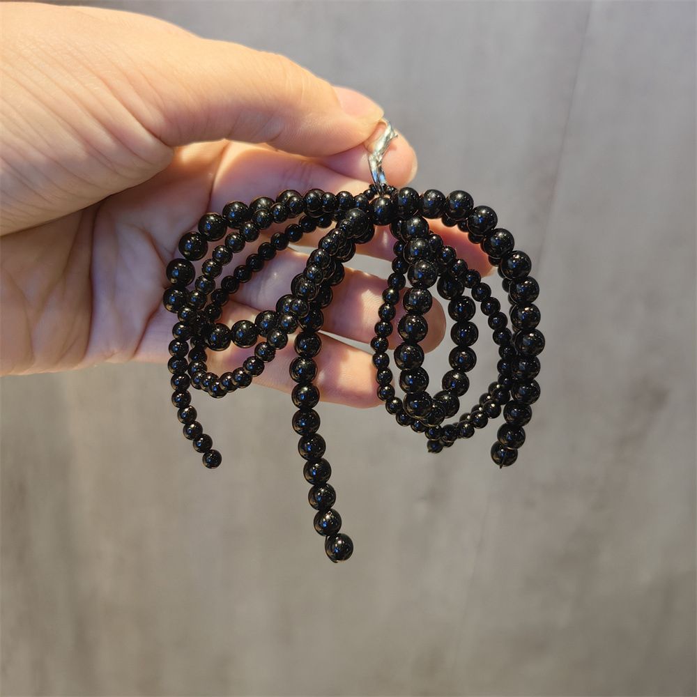 Charm de tenis perlas negra