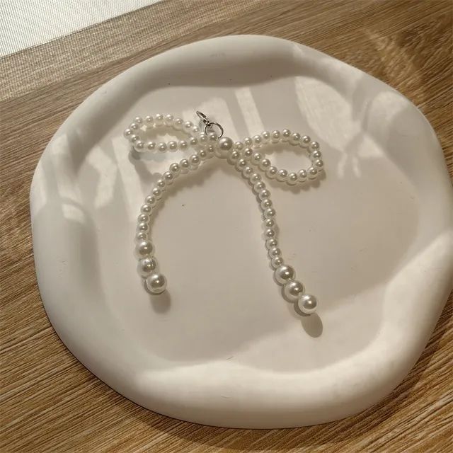 Charm de tenis moña blanca
