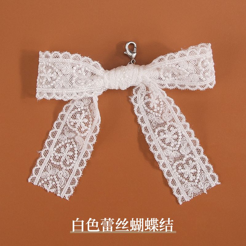 Charm de tenis moña de encaje blanco